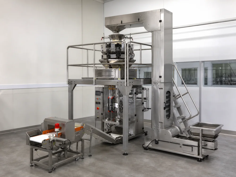 Vertical form-fill-seal machinery producing flexible packs